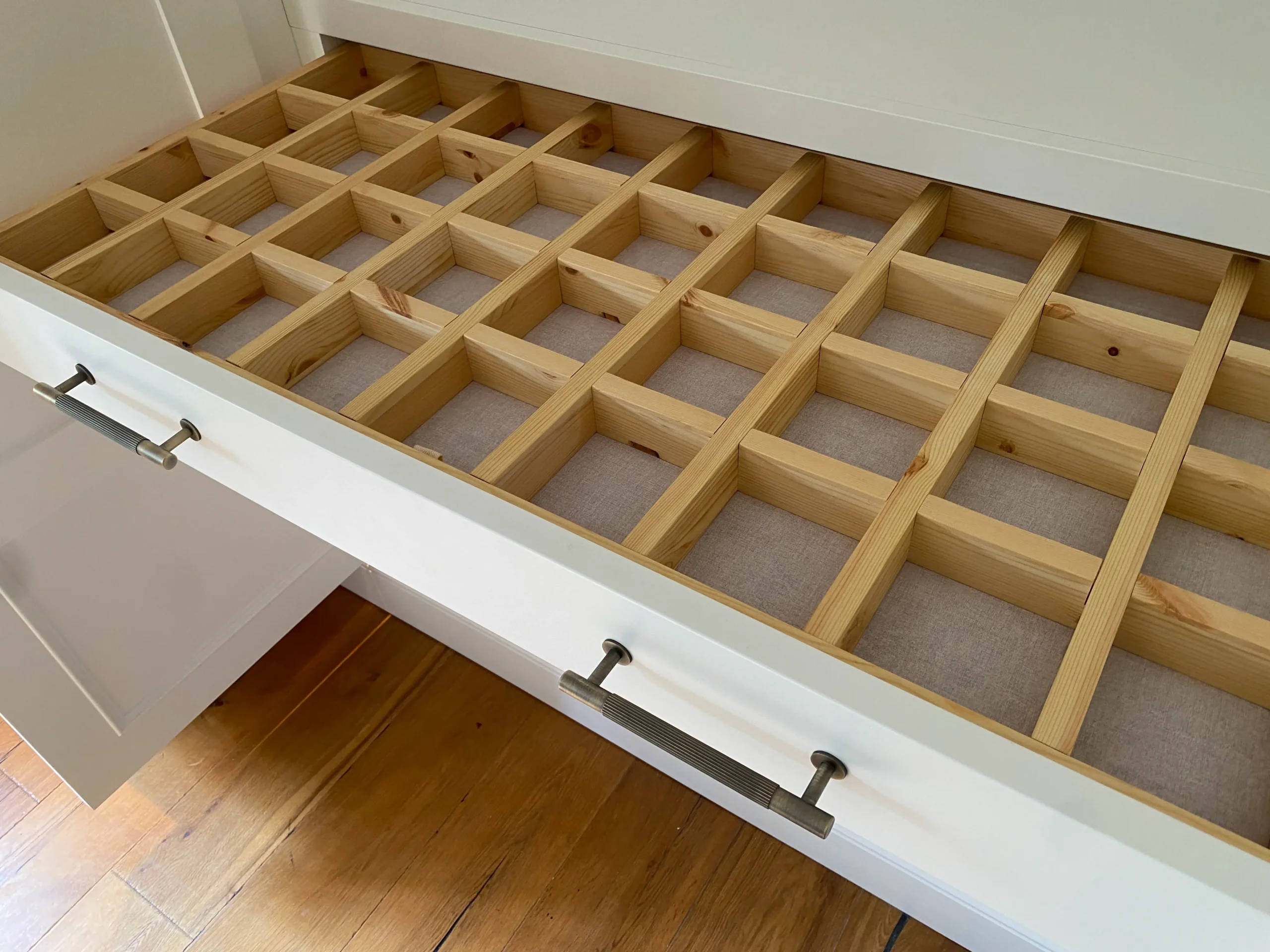 Inside a drawer with built in compartments - bespoke storage solutions.