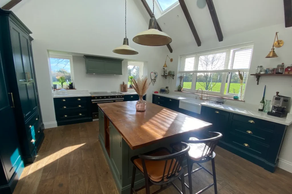 Hand-Built Kitchens in Sussex, dark green wood kitchen cabinets, kitchen island, wood worktop