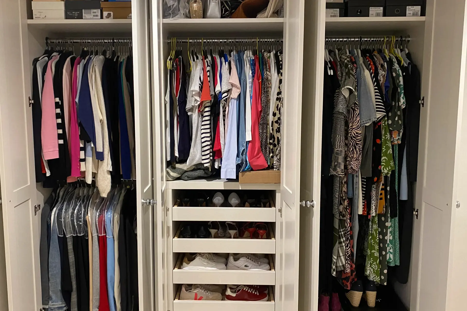 White built in wardrobe, with internal drawers and shelving