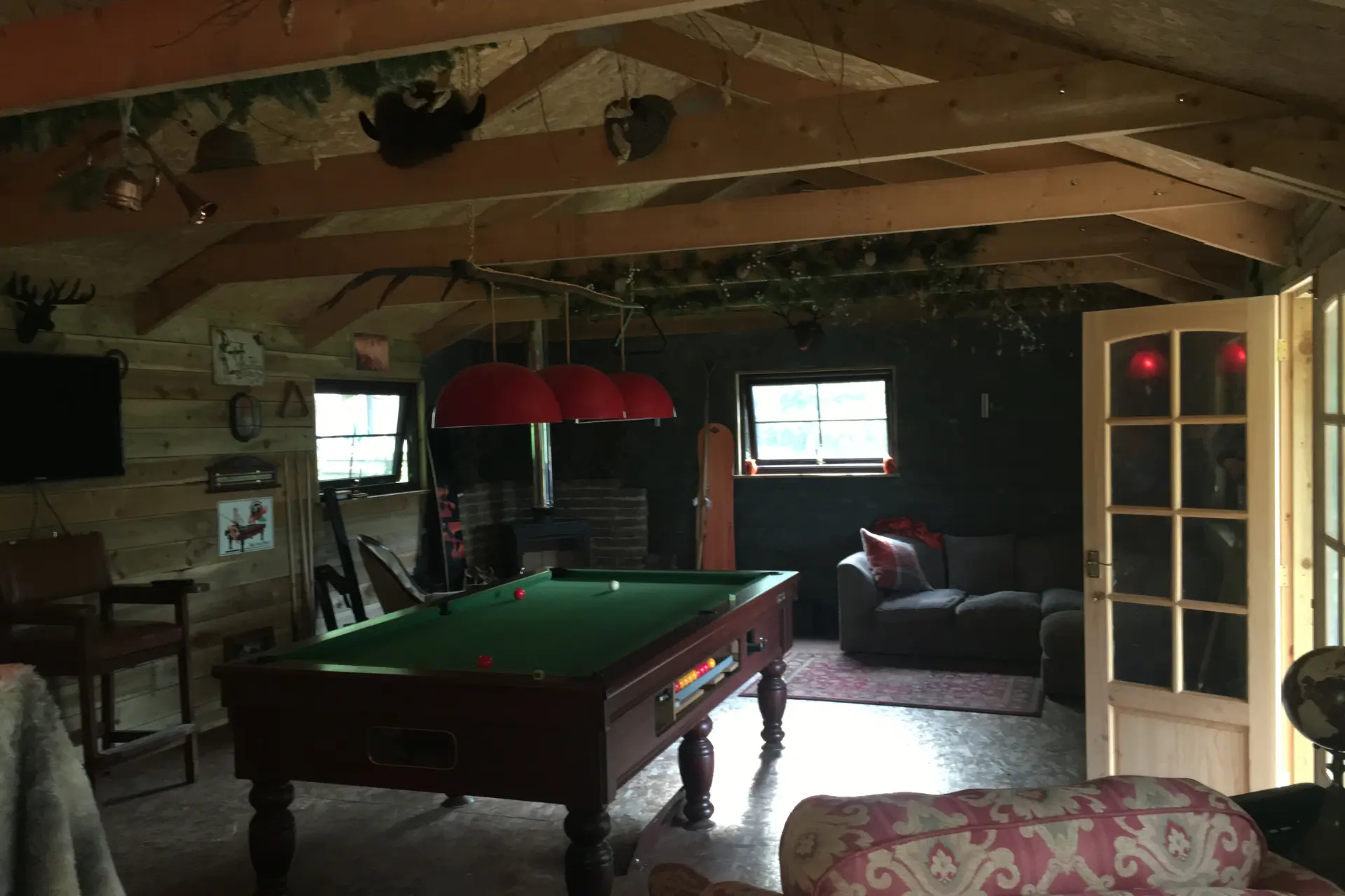 Pool table in a premium man cave and garden bar