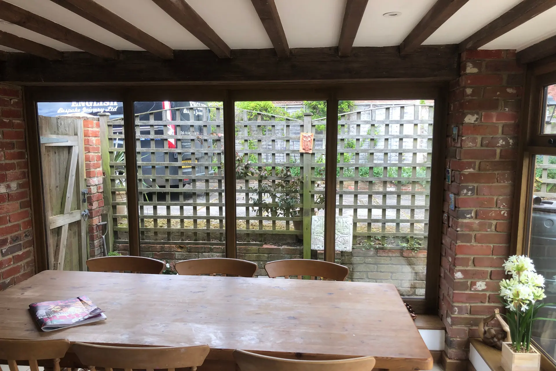 Inside a wooden garden pavilion used as a dining area