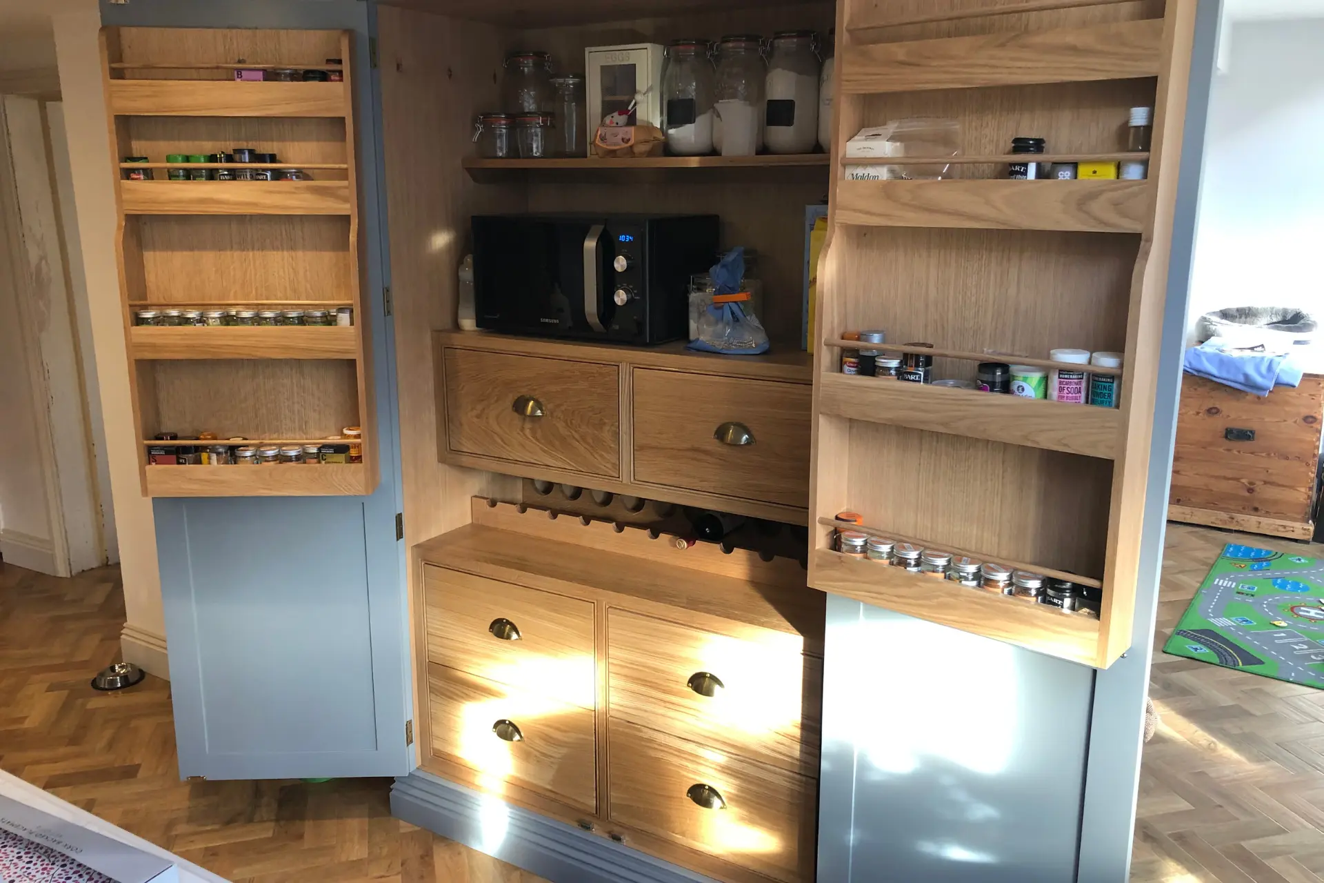 grey and oak bespoke pantry design open cupboard with shelving and drawers