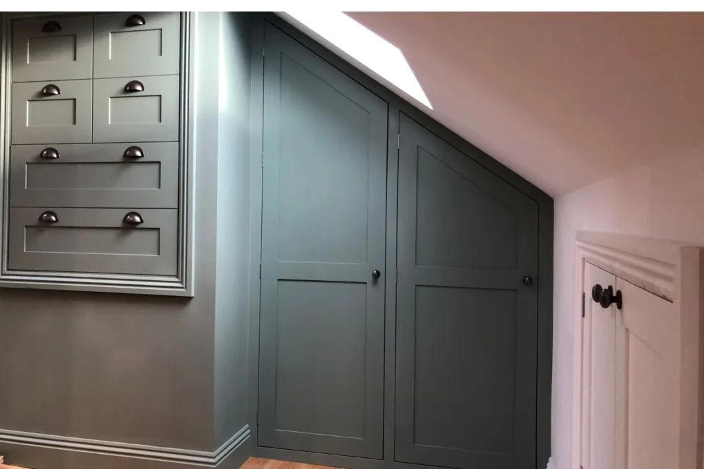 Interior Design Trends 2025 sage green fitted wardrobe in an alcove