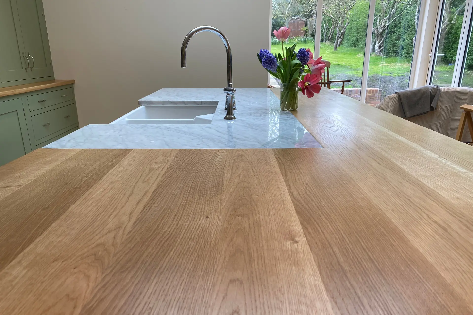 oak worktop surface and white integrated sink
